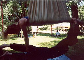 in a trapeze sling with a friend